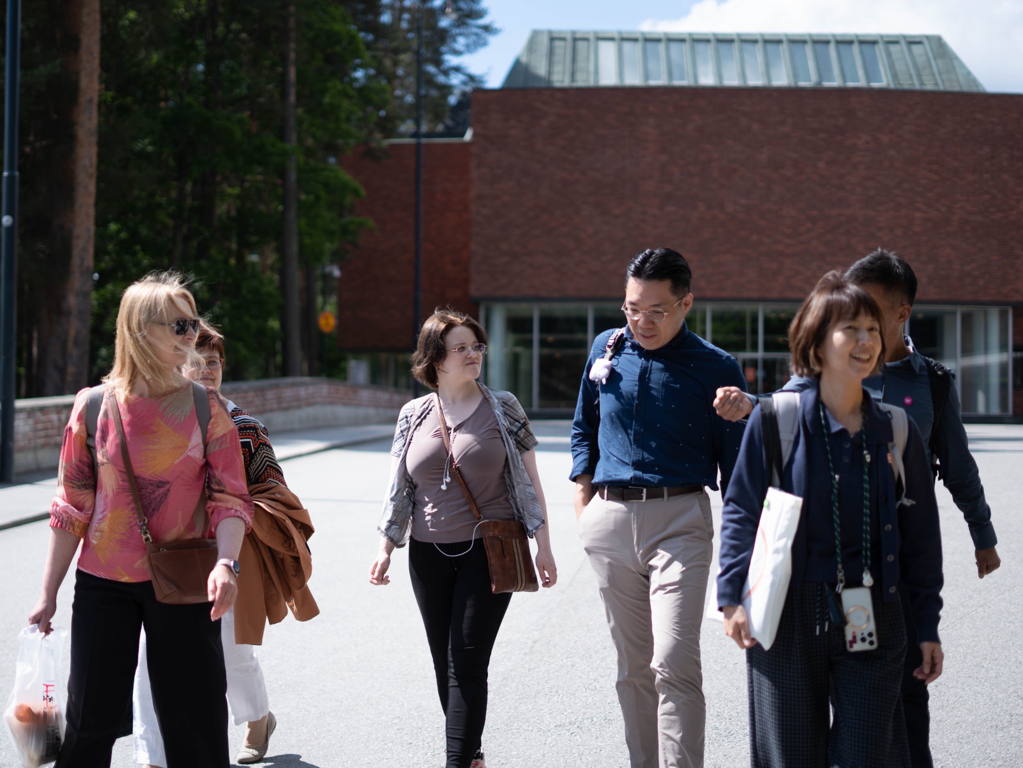 Participants walking across a university campus