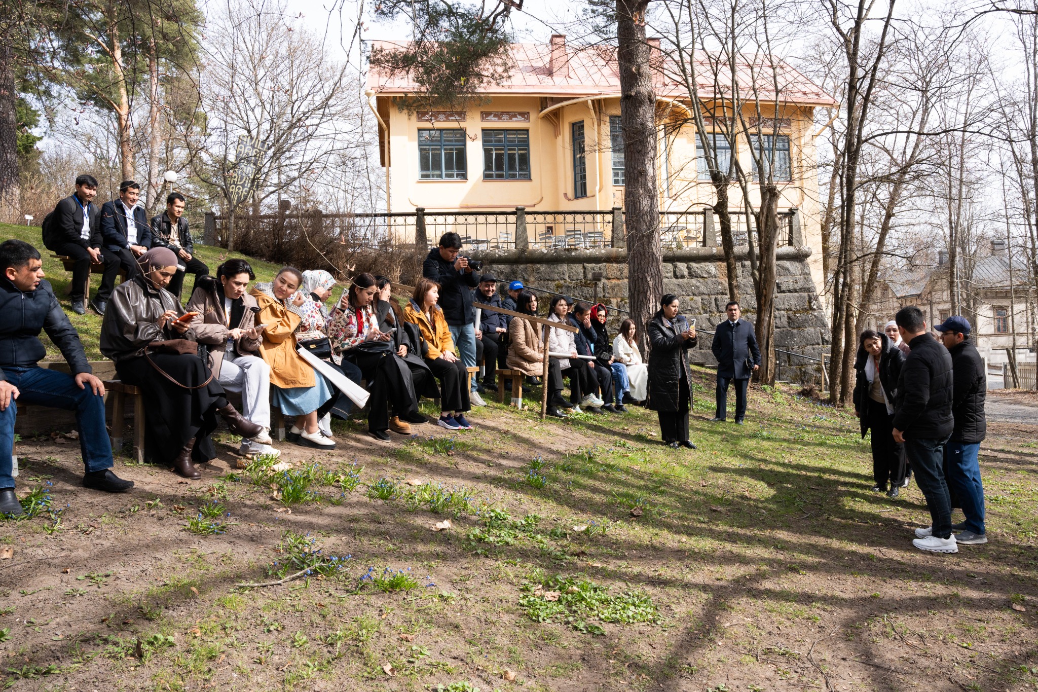 International educators in an outdoor group discussion